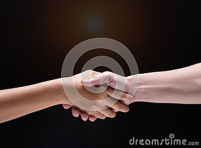 Closeup human hand touch together.They are shaking hand to be sign for trust and teamwork Stock Photo