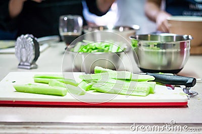 Closeup of Human hands cooking vegetables salad in kitchen Stock Photo