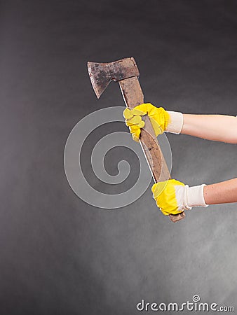 Closeup human hands holding axe chopper. Stock Photo