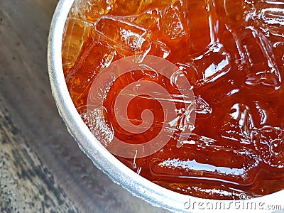 closeup iced tea on thai traditional silver bowl with copyspace. Stock Photo