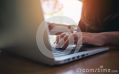 Closeup image of a business woman`s hands working , touching and typing on laptop keyboard Stock Photo