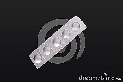Foiled Tablet Strip In Black Background Stock Photo