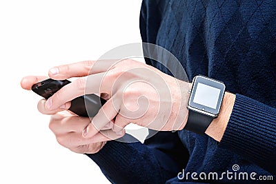 Closeup image of hipster male in blue pullover holding smartphone Stock Photo