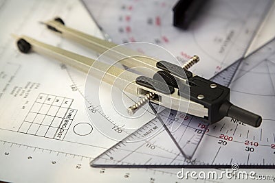 Closeup image of a navigator's radar plotting chart with a triangle and compass divider Stock Photo