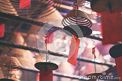 Spiral incenses hanging from the ceiling in Chinese temple Stock Photo