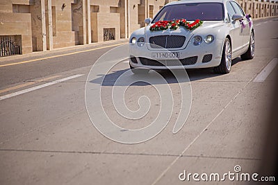 Closeup image of wedding car decoration with red and white flowers bouquet Editorial Stock Photo