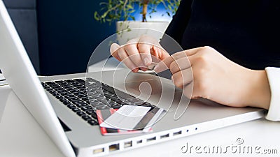 Closeup photo of woman working in bank checking credit card account Stock Photo