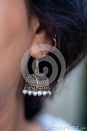 Closeup Indian girl wearing Jhumka or Jhumki, an Indian Style Earrings Stock Photo