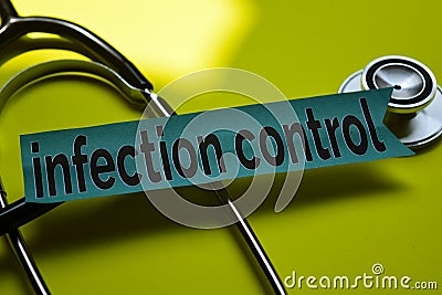 Closeup infection control with stethoscope concept inspiration on yellow background Stock Photo