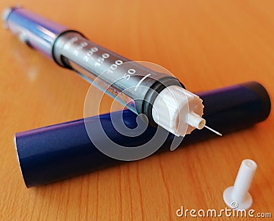 Closeup of insulin pen with needle for insulin injection for diabetics. World diabetes day. Stock Photo