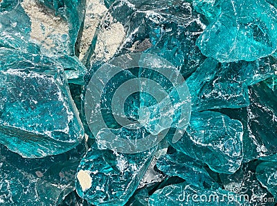 Closeup of isolated turquoise rough glas shards Stock Photo