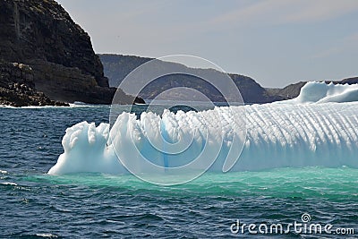 Closeup of jagged iceberg marooned along the coastline Stock Photo