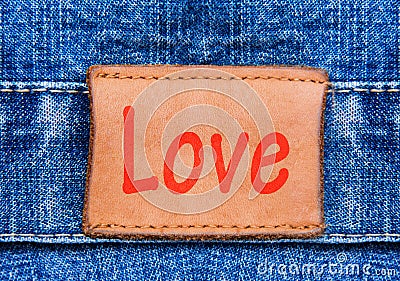 Closeup jeans leather label with text Love Stock Photo