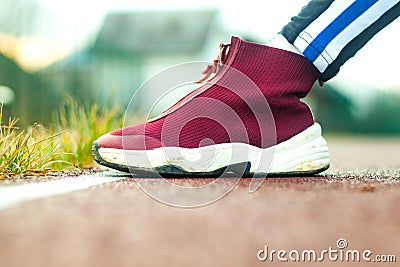 Closeup of jogger feet in red running shoes Stock Photo