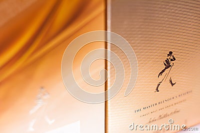 closeup of Johnny Walker blended whisky packaging box on supermarket shelves Editorial Stock Photo