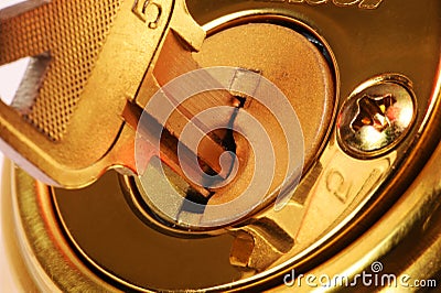 Closeup of key in lock Stock Photo