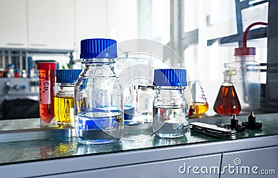 Closeup of laboratory glassware filled with various colored liquids Stock Photo