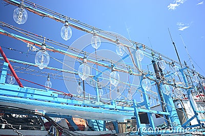 Closeup of lamps on a fishing boat under the sunlight and a blue sky at daytime Stock Photo