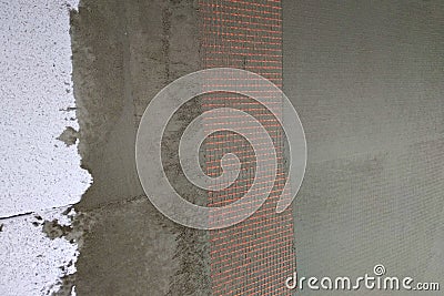 Closeup of layers over styrofoam insulation, mesh, plaster, cement, mortar, solution of glue Stock Photo