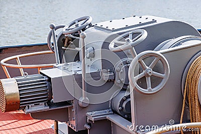 Closeup of levers, steering wheels, anchor windlass machine and heavy duty winches Stock Photo