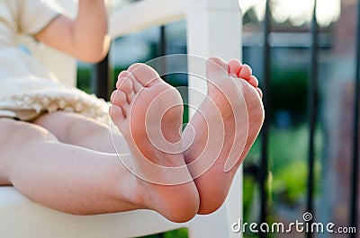 Closeup of little girls bare feet Stock Photo