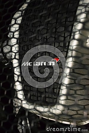 Closeup of the logo on McLaren 540C Engine behind the grill Editorial Stock Photo