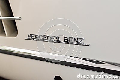 Closeup of the logo of Mercedes Benz on a vintage model car Editorial Stock Photo