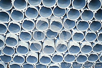 Closeup of a lot of aluminum pipes in a factory Stock Photo