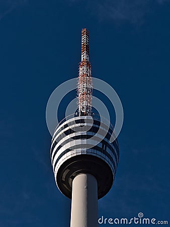Closeup low angle view of the top of famous Fernsehturm (tv tower) of Stuttgart, Germany located in district Degerloch. Editorial Stock Photo