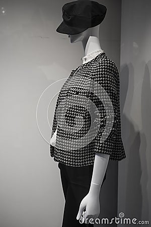 Luxury clothes on mannequin in a fashion store showroom Stock Photo