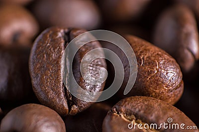 Closeup macro a group roasted brown or black coffee grains background Stock Photo