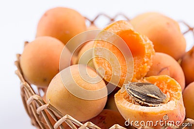 Closeup macro opened fresh apricots in the bowl. Stock Photo