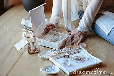 Closeup macro photo of details, workplace of decorator and creator of wedding imitation jewelry. Stock Photo