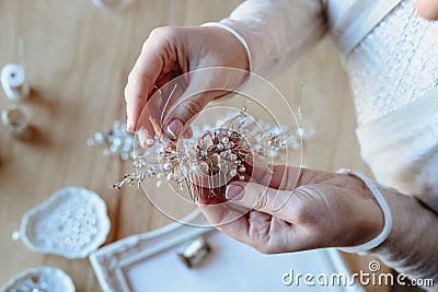 Closeup macro photo of details, workplace of decorator and creator of wedding imitation jewelry. Stock Photo