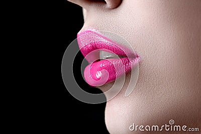 Closeup macro photo of pretty natural lips with pink glossy lips Stock Photo