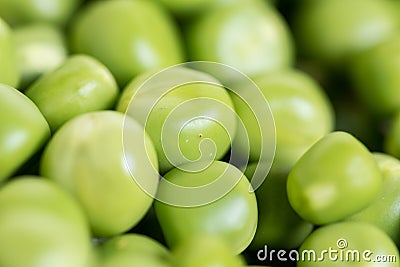 Closeup macro pile of fresh green peas ready for cleaning Stock Photo