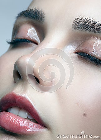 Closeup macro portrait of female face with eyes closed. Woman wi Stock Photo