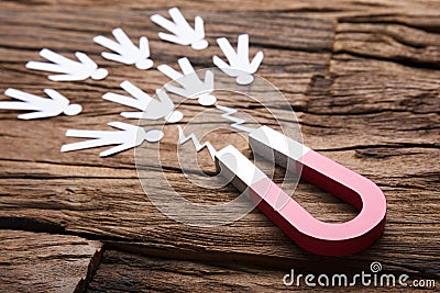 Magnet Attracting Paper Candidates On Table Stock Photo