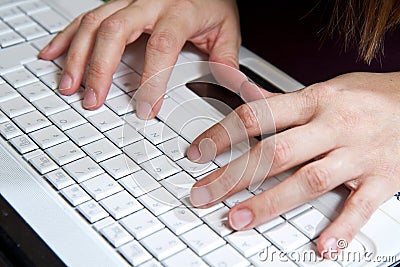 Closeup male fingers on the laptop Stock Photo