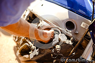 Closeup of male hand doing repair work on blurred Stock Photo