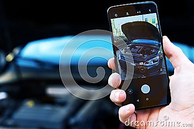 Driver take photo of car with engine Stock Photo