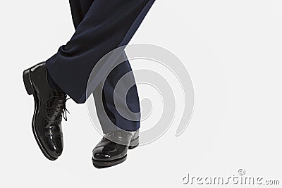 Closeup of Male's Stylish Oxfrod Brogue Shoes Posing with Legs C Stock Photo
