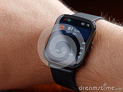 Closeup man checking health smart watch or smartwatch wearable technology sport smartwatch on fitness Stock Photo