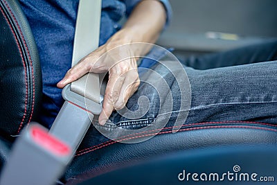 Closeup of man fastening seat belt in car, Safety belt safety first Stock Photo