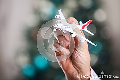 Closeup of man hand holding model of airplane Stock Photo