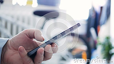 Closeup Man Hand Text Using a Cellphone and Access Network Online Applications Stock Photo