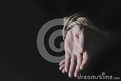 Man with his hands tied behind his back Stock Photo