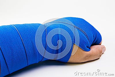 A closeup of a man with a hurt bandaged arm. Stock Photo