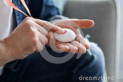 Closeup Of Man's Hand Pressing Alarm Button For Emergency Stock Photo