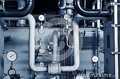 Closeup of manometer, pipes and faucet valves of heating system Stock Photo